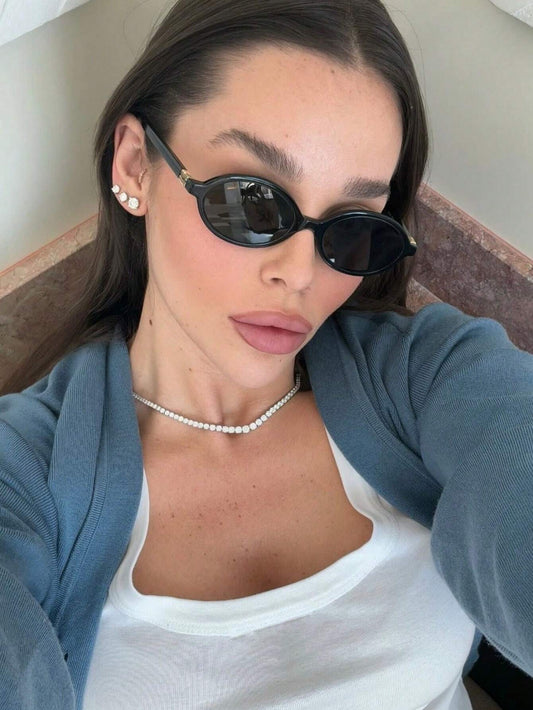 Retro Chic Black Oval Sunglasses with Gold Detail
