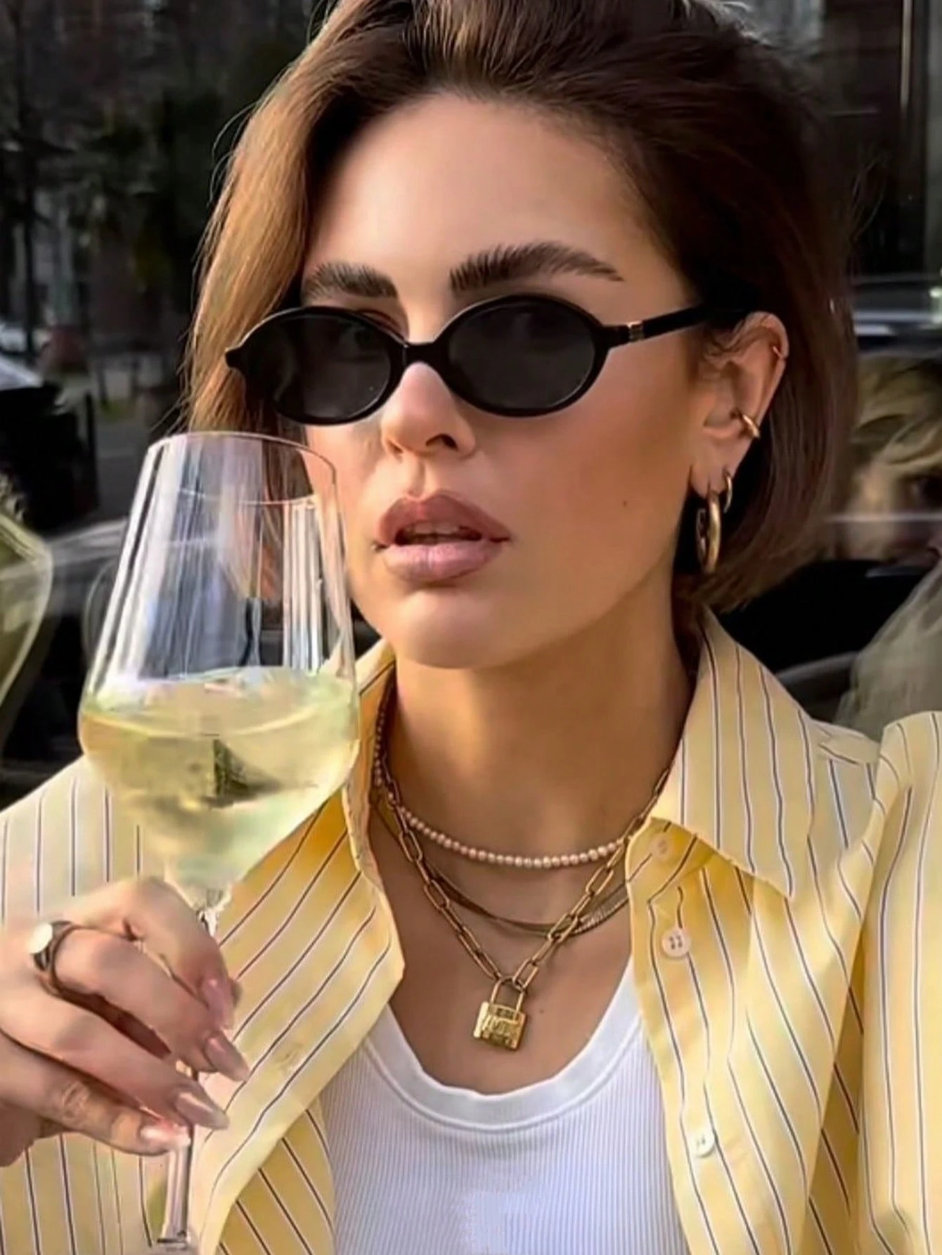 Retro Chic Black Oval Sunglasses with Gold Detail