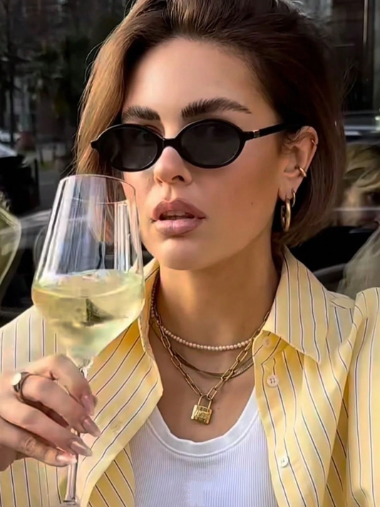 Retro Chic Black Oval Sunglasses with Gold Detail