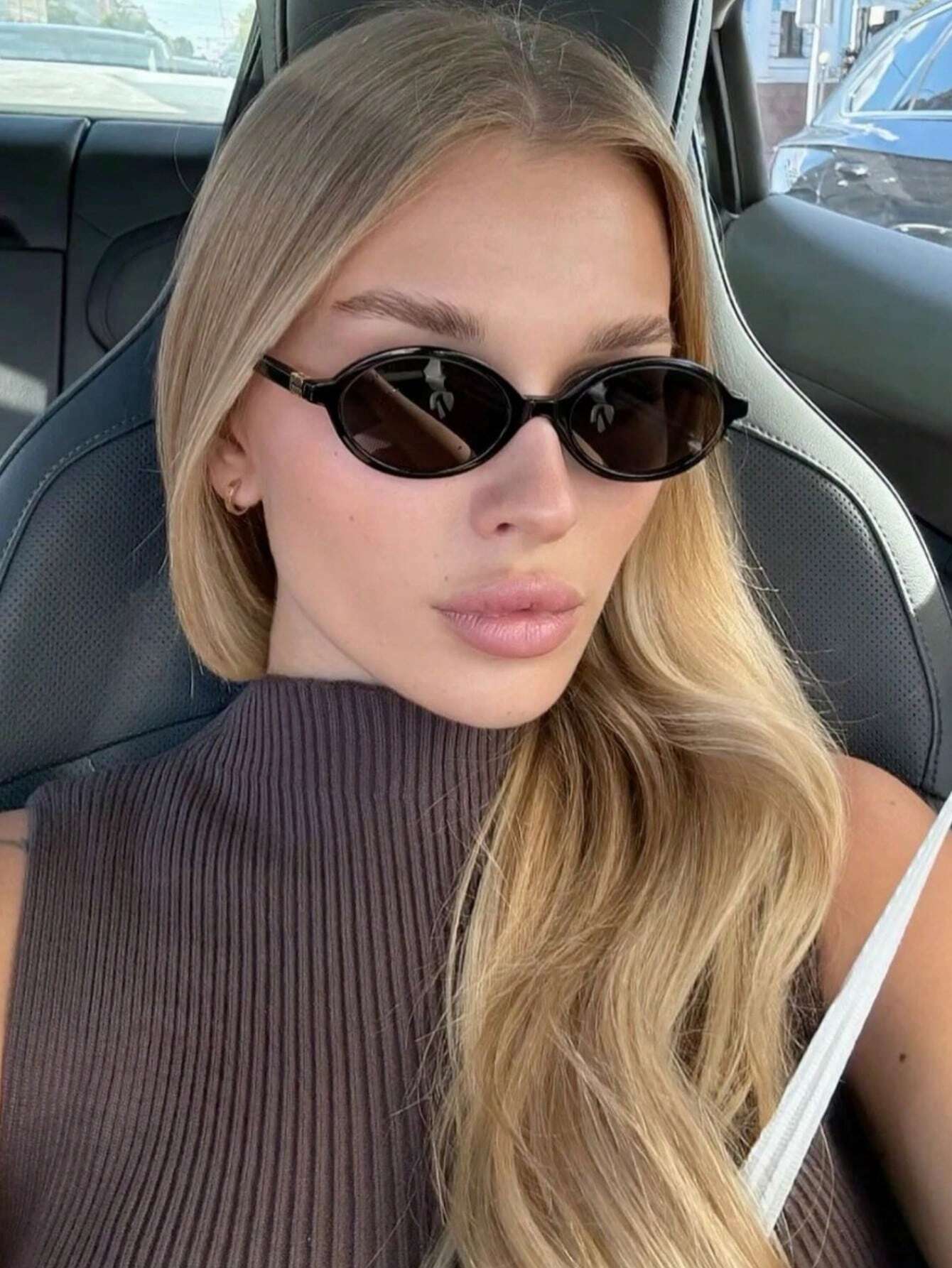 Retro Chic Black Oval Sunglasses with Gold Detail